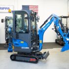 Rippa R15 Eco with enclosed cab mini excavator shown in showroom in Portland Oregon, front and side profile