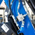 Rippa R15 Eco mini excavator hydraulic lines and fittings close-up, heavy-duty construction details