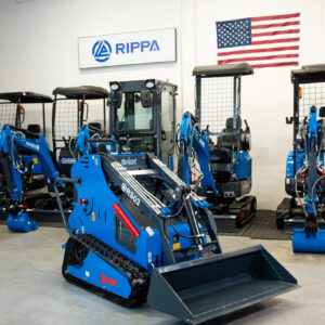 Rippa RS03 skid steer mini excavator with bucket attachment inside Portland Oregon showroom