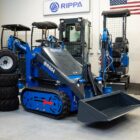Rippa RS04 skid steer mini excavator with bucket attachment shown in Portland Oregon showroom